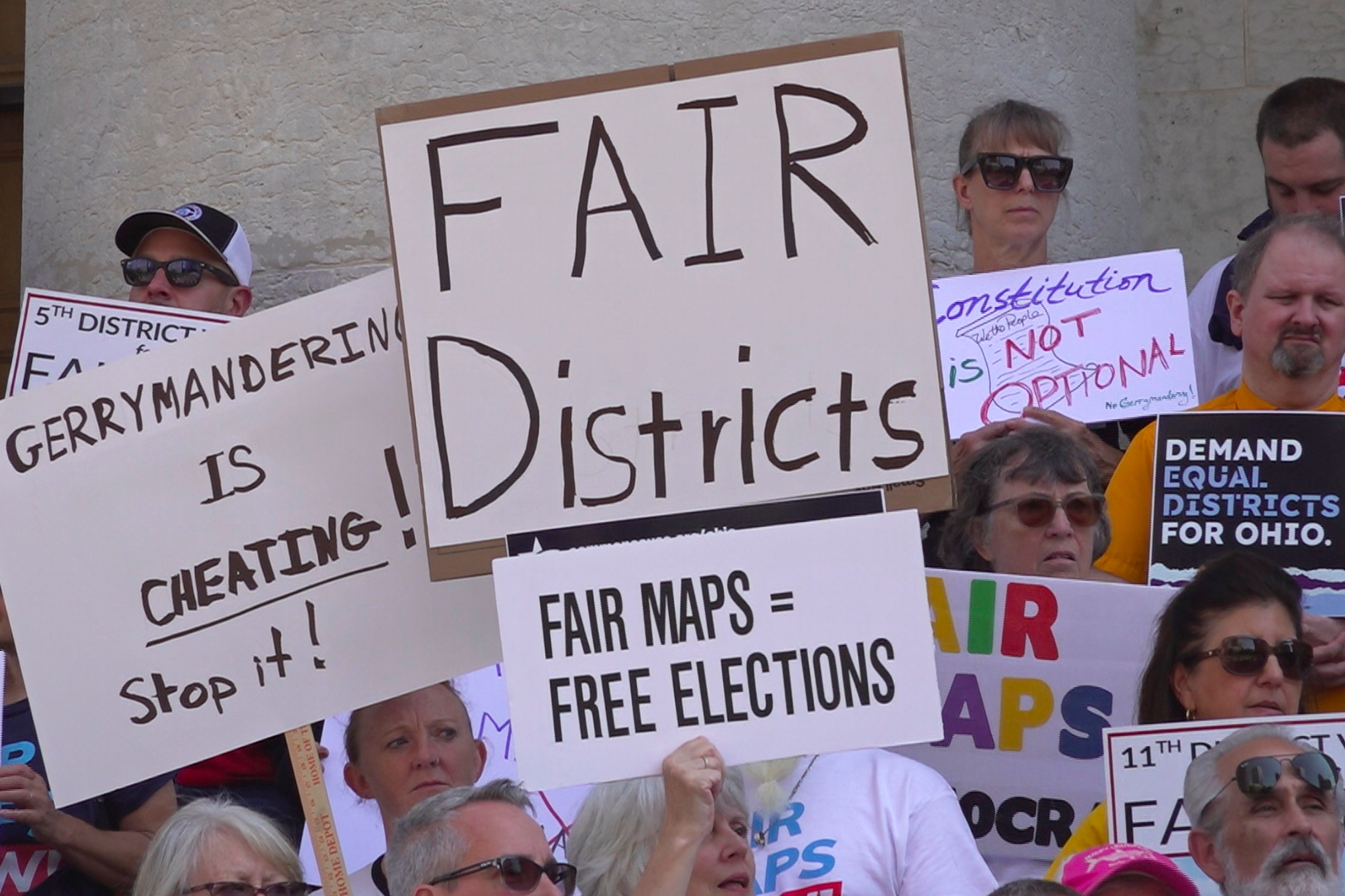 Demonstrators rally outside of the Ohio Statehouse to protest gerrymandering and advocate for lawmakers to draw fair maps in September in Columbus, Ohio.